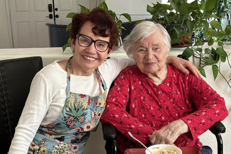 Mother and daughter sitting together